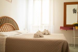 Postel nebo postele na pokoji v ubytování Hotel Ariston