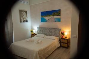 Postel nebo postele na pokoji v ubytování Hotel Ariston
