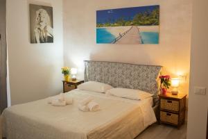 Postel nebo postele na pokoji v ubytování Hotel Ariston