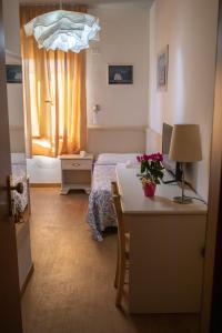 Postel nebo postele na pokoji v ubytování Hotel Ariston