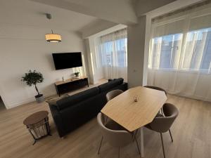 a living room with a couch and a table at The Crow Ajuda Apartment I in Lisbon
