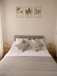 En eller flere senge i et værelse på Le Quai401 YourHostHelper