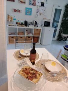 A kitchen or kitchenette at Antonella home b&b