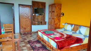 Кровать или кровати в номере Kasar Wonder Hill Homestay