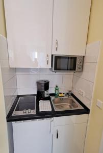 Nhà bếp/bếp nhỏ tại Appartementhaus Regina - Darmstadt - Griesheim