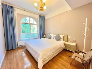 Ein Bett oder Betten in einem Zimmer der Unterkunft 福来小院民宿