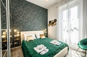 Ένα ή περισσότερα κρεβάτια σε δωμάτιο στο City Center Luxury Portofino - Free Parking - AC