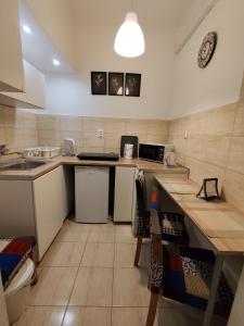 a small kitchen with a counter and a sink at LittleRoom in Lublin