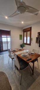 a dining room with a wooden table and chairs at Casa Rave 17 in Córdoba +16 photos
