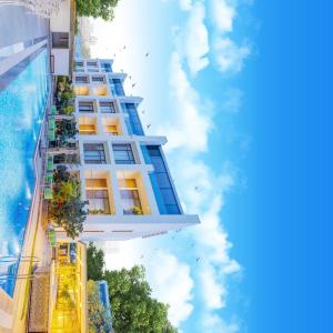 a tall building with a blue sky in the background at ELLAA RESIDENCES in Hyderabad