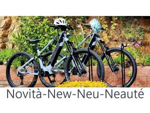 two bikes are parked next to each other at Eco Hotel Montemerlo in Fetovaia