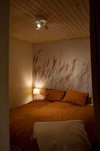 a bedroom with a bed with two pillows on it at Klintvägen 1 in Mariehamn +17 photos