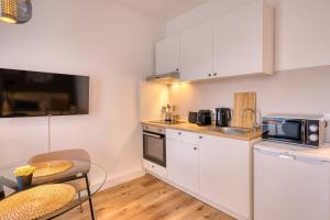 Kuchyň nebo kuchyňský kout v ubytování FullHouse Premium Apartments H11 + 9 fotografií