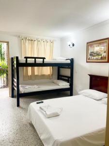 Postel nebo postele na pokoji v ubytování Hotel Casa Fátima