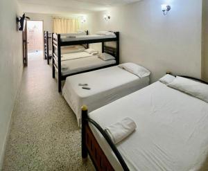 Postel nebo postele na pokoji v ubytování Hotel Casa Fátima