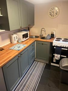 Køkken eller tekøkken på Turning Tides Holiday Cottage