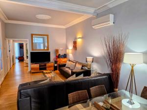 TV a/nebo společenská místnost v ubytování Luxury Central Apartment