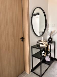 a room with a door and a mirror and a shelf at Lavington in Nairobi