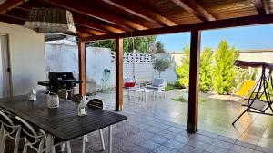a patio with a table and chairs on a patio at Casa Mayla in Manfredonia