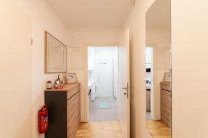 a small bathroom with a sink and a shower at Cozy garden apartment in Graz +20 photos