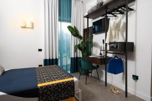 a bedroom with a bed and a desk and a desk at 1912 Relais - Sorrento Coast in Piano di Sorrento +113 photos
