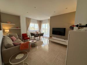 Et tv og/eller underholdning på Apartamento NARANJA GANDIA GRAU