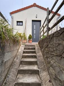 a set of stairs leading up to a house at Le Bulloire in Montlouis-sur-Loire