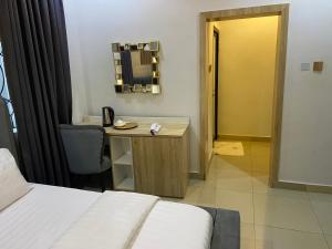 Postel nebo postele na pokoji v ubytování Domar Suites