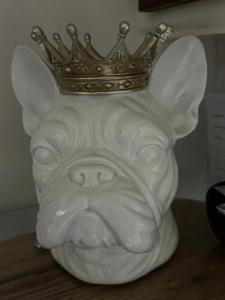 a statue of a dog with a crown on its head at Kelston Guest House in Weymouth