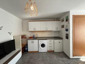 a kitchen with a washer and dryer in it at Arslan Homes 4 in Marmaris +2 photos