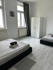 Postel nebo postele na pokoji v ubytování Monteurwohnung Burchard I Rosenau - Platz für 6 Personen