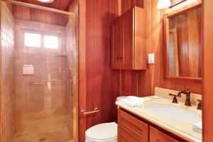 a bathroom with a shower and a sink and a toilet at High-Top Lakeview Chateau Relaxing Modern Fawnskin Retreat in Fawnskin +31 photos