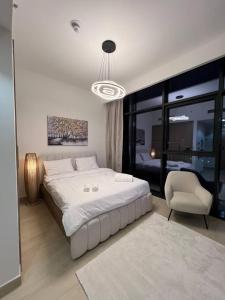 Кровать или кровати в номере Luxury Relaxing Stay Near Dubai Downtown