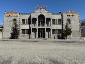 an old building with a balcony on top of it at Lenko in Goris