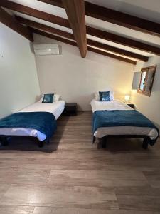 Ένα ή περισσότερα κρεβάτια σε δωμάτιο στο Maison de village corse