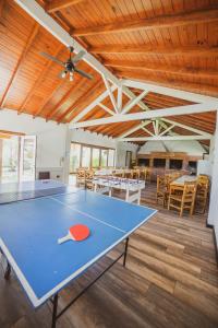 a ping pong table in the middle of a room at Costa Remanso in Miramar