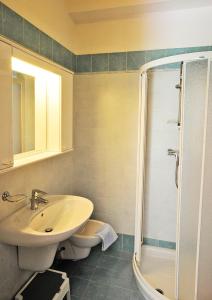 a bathroom with a sink and a shower at Casa Vittoria in Nago-Torbole