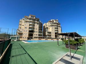 Swimmingpoolen hos eller tæt på Apartamento NARANJA GANDIA GRAU