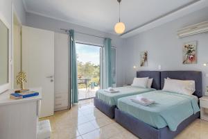 a bedroom with a large bed and a balcony at Andreas Hideaway Palaiokastritsa in Paleokastritsa