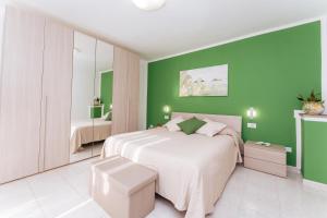 Ένα ή περισσότερα κρεβάτια σε δωμάτιο στο Residenza Il Moro