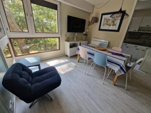 a kitchen and dining room with a table and chairs at 450m plage Bourdaines in Seignosse