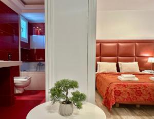 A bed or beds in a room at Hotel Apartments Panorama
