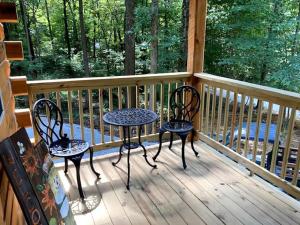 two chairs and a table on a porch at Stairway to Heaven in Birdseye +11 photos
