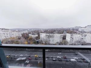 a view of a parking lot from a balcony at Avenue Boutique Apartments N3 in Chişinău