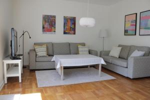a living room with a couch and a coffee table at Villahassel in Middelfart