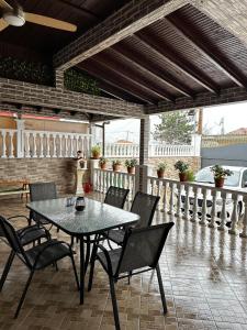 a table and chairs sitting on a patio at Gano Appartement in Katerini