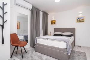 Postel nebo postele na pokoji v ubytování Bogdanović Winery Apartman