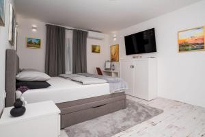 Postel nebo postele na pokoji v ubytování Bogdanović Winery Apartman