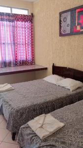 Postel nebo postele na pokoji v ubytování Hotel Posada Quetzal