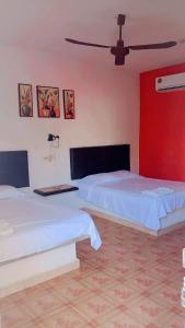 Postel nebo postele na pokoji v ubytování Hotel Posada Quetzal